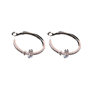 Elegant silver zircon Saturn hoop earrings with shimmering crystal accents on white background
