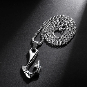 Detailed view of a silver stainless steel fish hook pendant with a sturdy box chain necklace