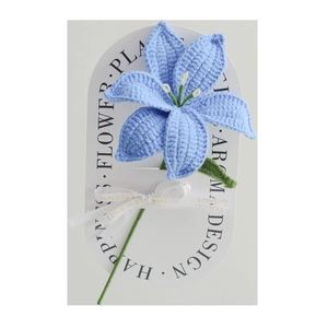Handmade crochet lily bouquet in blue with green stems and elegant gift packaging