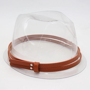 Close-up of transparent plastic hat support and vintage brown faux leather strap