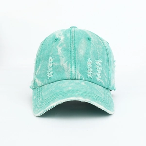 Detailed view of heavy washed teal cotton baseball cap with distressed edge and rip finish
