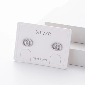 Detail of S925 sterling silver double hoop earrings with sparkling cubic zirconia pavé