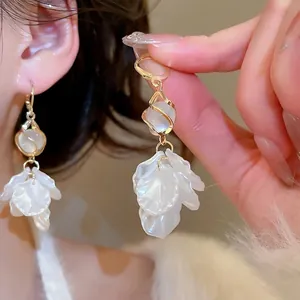 Elegant gold petal tassel earrings with white pearls for a vintage luxury jewelry look