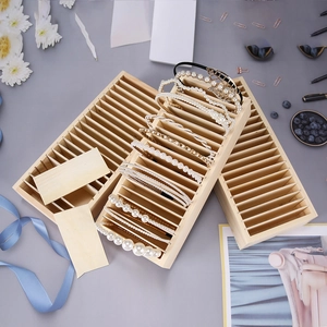Wooden headband display stand with multiple slots for organizing hair accessories