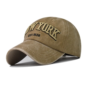 Detail of vintage washed khaki baseball cap featuring 3D NEW YORK embroidery and EST.1625 text