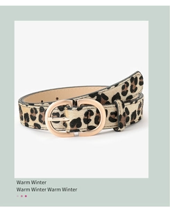 Detail of leopard print belt with faux calf hair texture and golden CD metal buckle