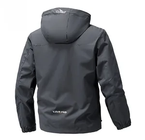 Detail of dark grey hooded jacket back view with white mountain logo and trend lettering
