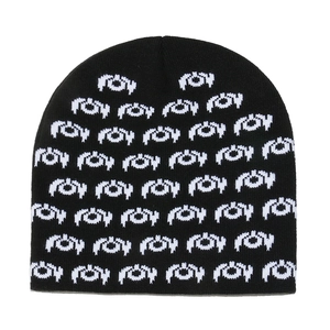 Winter knitted beanie hat with black and white jacquard pattern for thermal protection