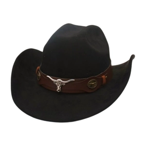 Detail of western cowboy hat with brown leather band and silver bull head metal ornament