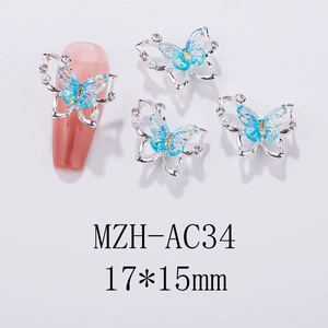 Detailed blue butterfly nail charm with silver frame, pearls and rhinestones 17x15mm