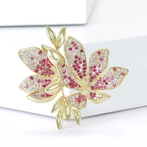 Elegant floral brooch with pink and red cubic zirconia in a gold-plated flower design