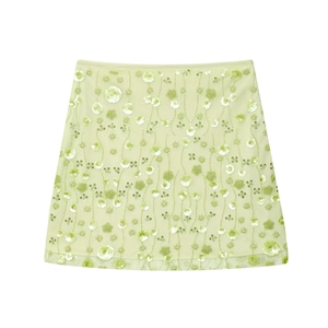 High waist mint green mesh mini skirt with floral sequins and embroidery on white background
