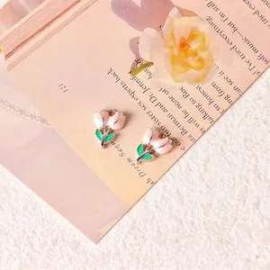 Detail of tulip flower pendants in pink and green enamel with 12x16mm size spec