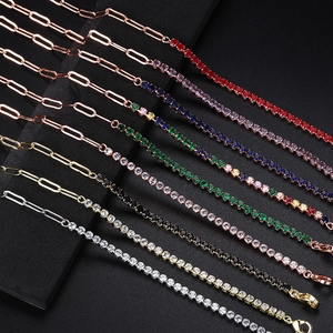 Detailed close-up of colorful CZ tennis bracelets with paperclip chain links