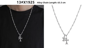 Detail of gothic double cross pendants on a 63.5cm chain with ornate silver finish