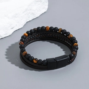 Men's handmade layered bracelet with black obsidian beads, tiger eye stone, and brown leather