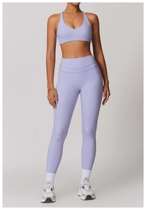 Detail view of high-waist lavender yoga pants and sports bra set for women fitness