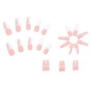 Long trapezoid press-on nails with pink and white geometric lines and tiny rhinestones