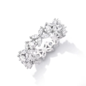 Detailed macro view of the butterfly flower shaped setting in silver with clear gemstones