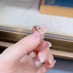 Macro detail of rose gold chain ring with sparkling micro-pave cubic zirconia stones