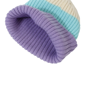 Close-up of color-block ribbed knit beanie showing high-quality stitching and purple texture