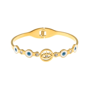 Macro view of gold stainless steel bangle featuring evil eye motifs and crystal accents