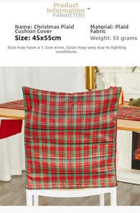 Detail of red and green plaid Christmas chair cover in a cozy home fireplace setting