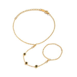 Gold chain slave bracelet with green zircon stones and adjustable finger ring