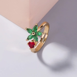 Adjustable gold open ring with a five-petal green gemstone flower and red accents