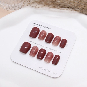 Burgundy and glitter gradient press-on nails in short square shape on display card