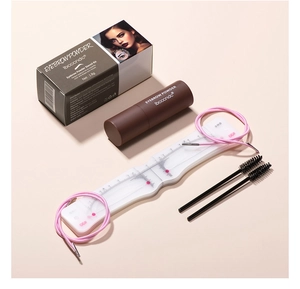 Detailed set of brown eyebrow powder stamp kit with stencil tool and two spiral brushes