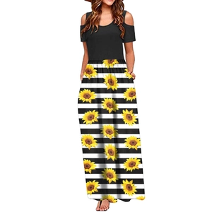 Detail of cold-shoulder sleeve and sunflower stripe print on summer maxi dress