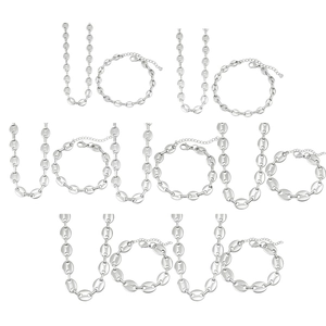 Detailed macro view of silver stainless steel coffee bean link necklaces and bracelets
