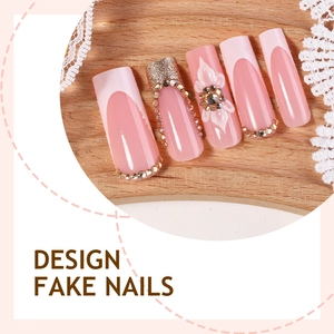 Faux ongles roses avec fleurs 3D, French tips et strass de forme carrée longue élégante