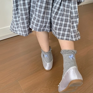 Grey knit cotton crew socks with blue bow detail styled with satin ballet flats