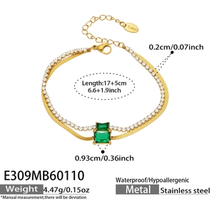 Detail view of double-layer stainless steel gold bracelet with green emerald zircon