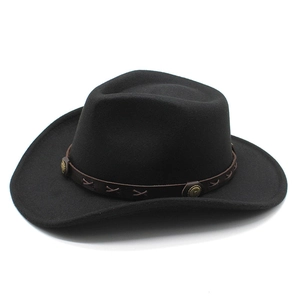Detail of black western cowboy hat with brown leather band and metallic concho studs
