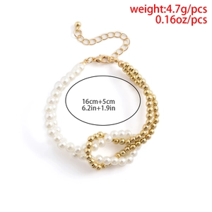 Detail of beaded bracelet showing half white pearls and half gold metal beads with clasp