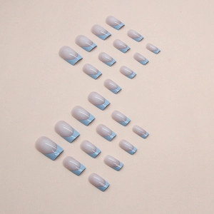 Minimalist French square press-on nails with nude pink base and soft blue tips