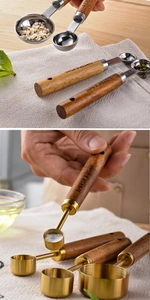 Close-up of wooden handle measuring spoons with engraved capacity markings for baking