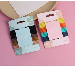 Detailed view of 16-piece high-elastic hair tie sets in assorted colors and floral packaging