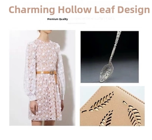 Macro detail of leaf-shaped laser cutouts on cream leather long purse with lace texture
