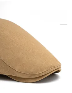 Detail of adjustable khaki ivy cap brim with premium stitching and foldable design