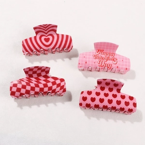 Set of four heart pattern shark hair clips for Valentine's Day in red and pink colors