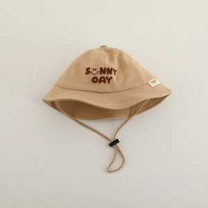Detail of kids beige bucket hat with Sunny Day embroidery and adjustable windproof cord
