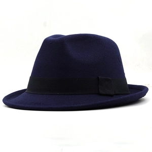 Close-up of a navy wool fedora hat featuring a classic black grosgrain ribbon band decoration