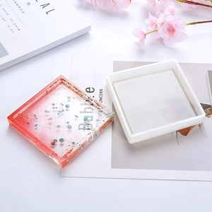 Square silicone resin mold and finished pink glitter coaster for DIY handmade crafts
