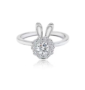 Detailed view of revolving rabbit ring with zircon halo setting and silver finish
