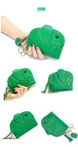 Detailed close-up of green elephant leather coin purse with gold zipper and tassel keychain