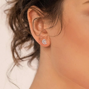 Elegant S925 sterling silver tree of life moon stud earrings worn on a female model